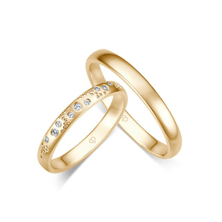 Trauringe mit neun Brillanten, punktiert in Gelbgold
