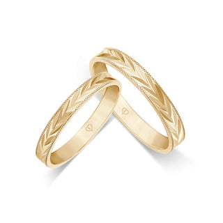 Trauringe mit symmetrischem Blütenmuster in Gelbgold